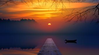 pier on the tranquil lake at sunset