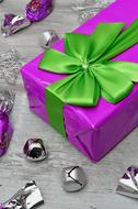 purple gift and green bow