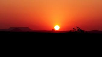 red sunset and white sun over America