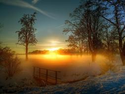 foggy lake at calm winter Sunset