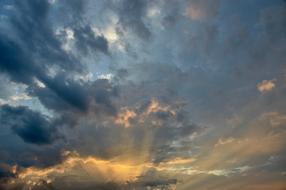 Beautiful and colorful sunset with dark clouds in the sky