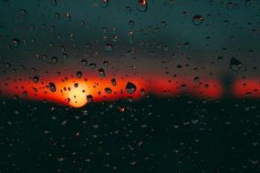 sunset trough the wet window