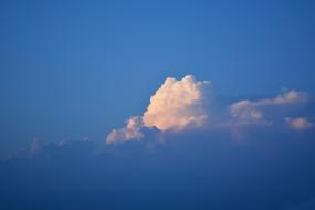 thick white clouds in a bright blue sky