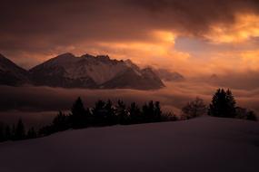 Beautiful mountains and nature under colorful sunset in winter in Vorarlberg, Austria