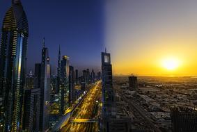 Cityscape with skyscrapers at night in morning at beautiful and colorful sunset background