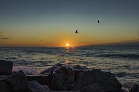 sunrise on the horizon above the water in Nj