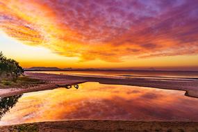 reflection of the orange sky in the sea in Australia