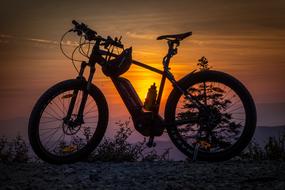 bicycle on a background of romantic orange sunset