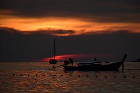 Boats on sea at dusk, thailand