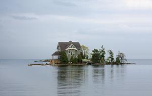 house on an island on a lake