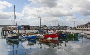 Colorful shops in the beautiful sea harbor in Ireland