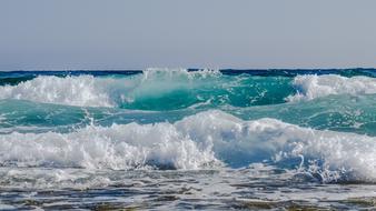 foamy spray of turquoise waves