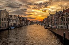 architecture along water canals in holland at dusk