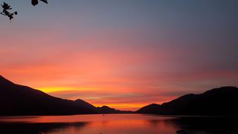 red twilight over the lake in the mountains