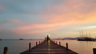 Beautiful pier at beautiful and colorful sunset in Thailand