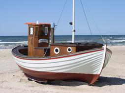 Fishing Boat on a sandy shore in denmark