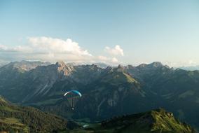 skydiver flies over the mountains in Vorarlberg, Austria
