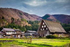 photo of a small village on a background of mountainsf