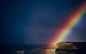 Rainbow blue dark sky