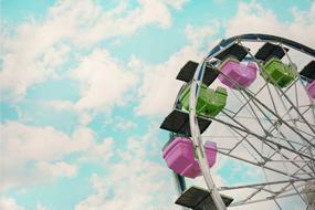 photo of ferris wheel with multi-colored cabs