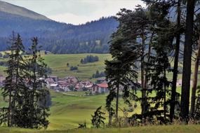 alpine village in green valley, switzerland