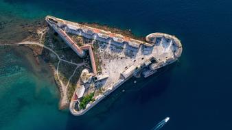 Beautiful and colorful fortress in Croatia, among the sea, from the view from the drone