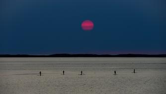 Beautiful pink Sun above the sea in Quebec, Canda