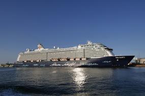 cruise ship in port at sunset