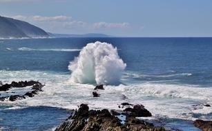 Beautiful, big, white wave on the rocky beach of the Tsitsikamma, South Africa