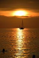 Boat on the water under beautiful and colorful sunset in Lipe, Thailand