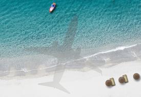 airplane shadow on a scenic beach