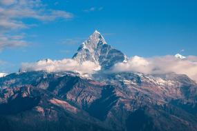 white clouds on top of the Himalaya mountain system in Asia