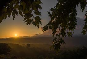 sun over mountains at dusk