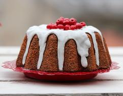 cupcake in white icing with red berries