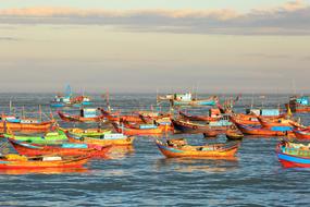 many colorful boats in the harbor of nha trang city