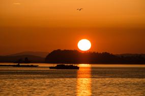 golden streak of the evening sun on the surface of the sea