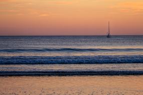 surf in pink twilight