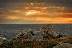 Beautiful coast with the rocks at beautiful and colorful sunrise background