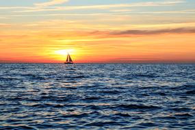 Sailboat on Sea at Sunset