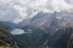 Panorama of beautiful Dolomites in white clouds in Italy