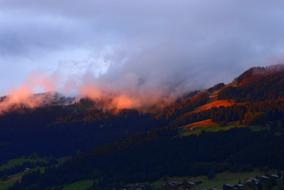 fog over the alps at dusk
