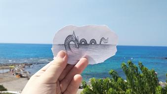 drawn sea snake on a background of the sea