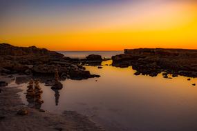 Landscape of the beautiful rocky coast at beautiful and colorful sunset background in Ayia Napa, Cyprus in Greece