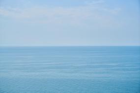 Beautiful, blue waterscape, at blue sky with white clouds in the morning