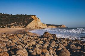 deserted rocky beach on a sunny day