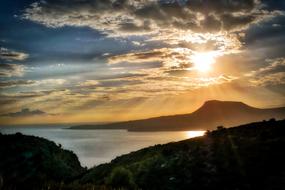 sun rays in the clouds on a picturesque landscape