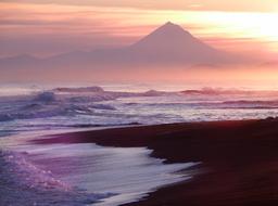 waves by the ocean during sunset
