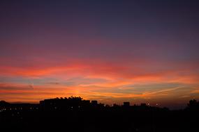 orange twilight in the sky over silhouettes