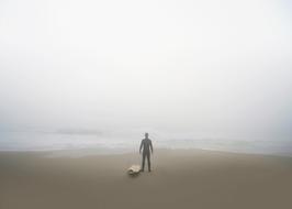 surfer on the coast in the fog