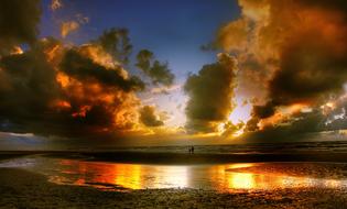 Beautiful and colorful sunset in the clouds above the sea in Denmark